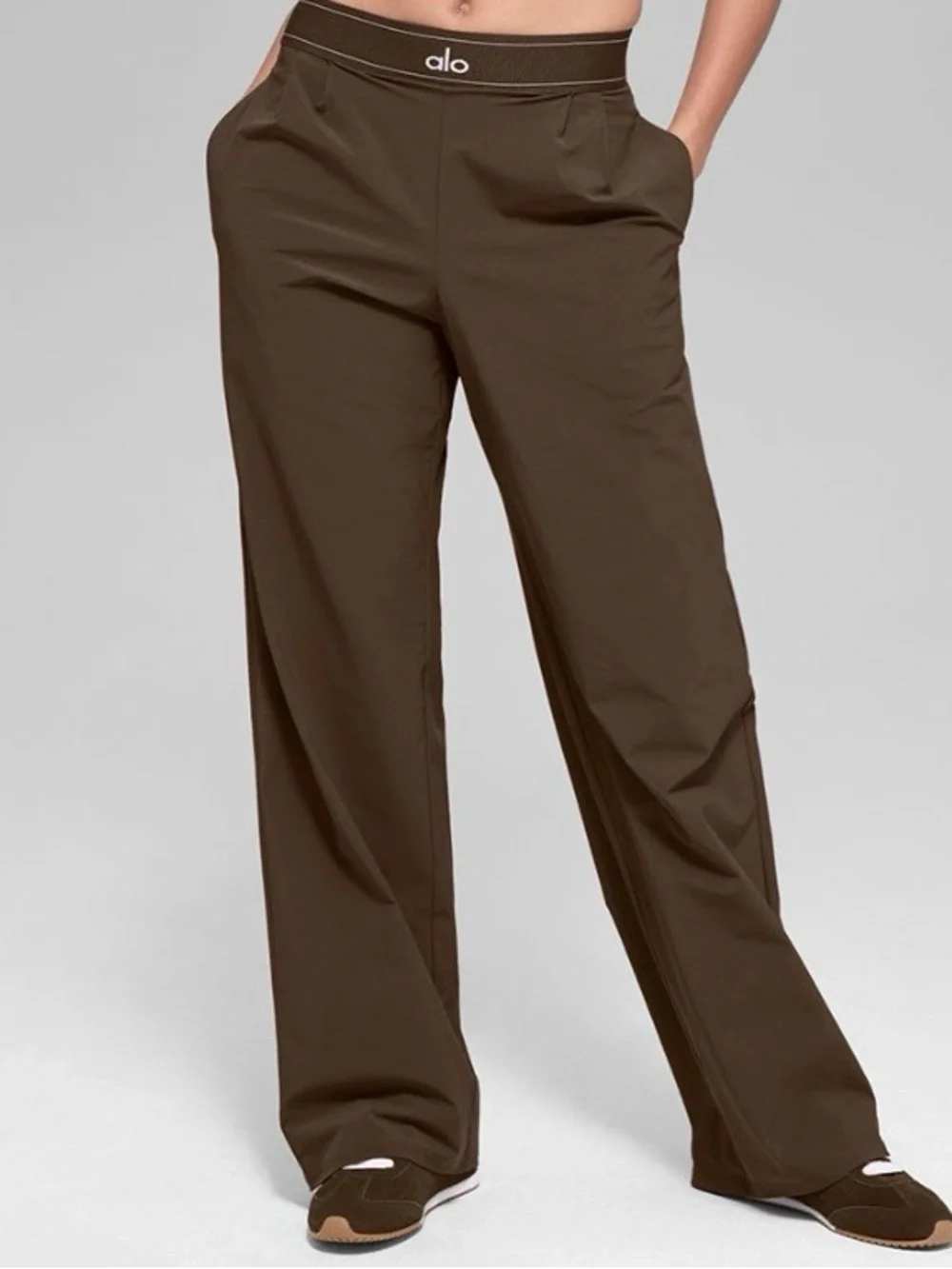 ALO Yoga female, espresso trousers.